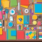 A table filled with colorful paper, scissors, glue, paint, brushes, markers, and other craft supplies neatly organized in containers