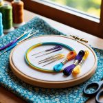 A colorful embroidery hoop with various threads and needles, a patterned fabric, and a pair of scissors on a wooden table with natural light streaming in from a nearby window
